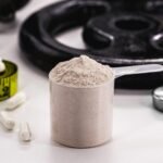 Creatine monohydrate supplement with a scientific illustration of the brain and gut microbiome, highlighting research into creatine, brain health and gut-related inflammation.