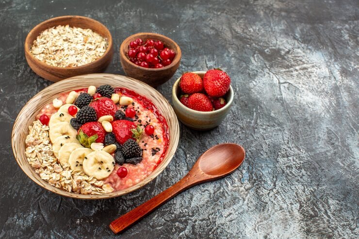 Healthy oatmeal breakfast bowl topped with walnuts, fresh blueberries and chia seeds for supporting brain, heart and gut health.